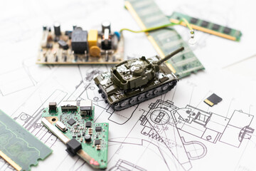 The toy tank is on the table. Children's toy military tank