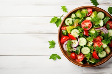 Tomatoes and cucumbers vitamin salad in a white bowl, wood background.