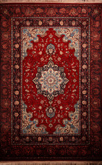 Red color persian carpet with antique pattern on the floor top view