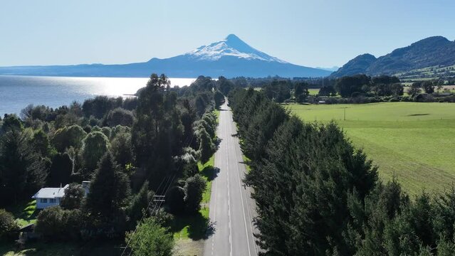 Patagonia Road At Porto Octay In Los Lagos Chile. Volcano Landscape. Sky Clouds Background. Los Lagos Chile. Road Trip Mountain. Patagonia Road At Porto Octay In Los Lagos Chile.