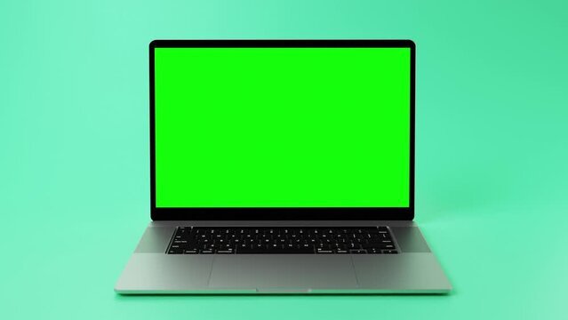 Animation of Modern laptop with green screen on display for chroma keying in front of mint green backdrop.