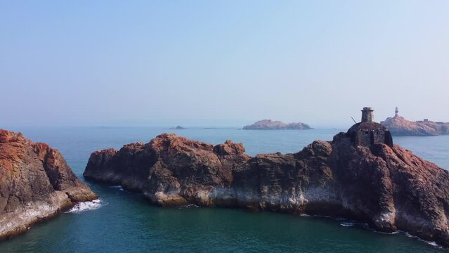 drone view of lighthouse in the middle of arabian sea in Malvan, Maharashtra