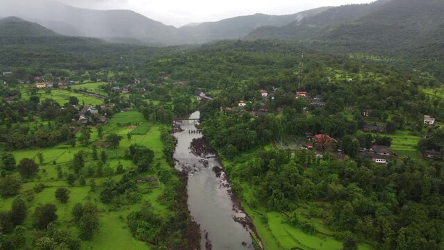 Drone view of River passing through rural village in maharashtra