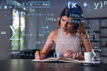 Smiling woman in casual wear taking notes in notebook at office workplace with coffee cup. Concept of distant business education, information technology, dreaming, thinking. Math drawings