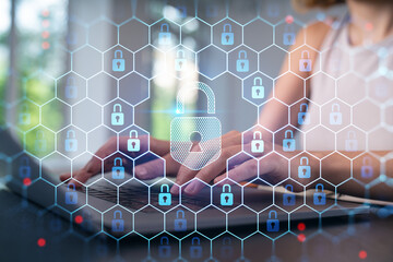 Woman typing on laptop at office workplace in background. Concept of working process, internet surfing, online business education. Student send e-mail. Close up view. Padlock icons
