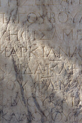 Inscriptions in old greek written in walls and columns in Acropolis of Athens, Greece