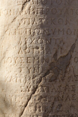 Inscriptions in old greek written in walls and columns in Acropolis of Athens, Greece - obrazy, fototapety, plakaty