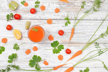 Detox drink in a glass goblet, carrot and parsley slices on a wooden background. Fresh natural carrot smoothie or juice, weight loss concept, fresh fruits and vegetables, cafe advertisement, 