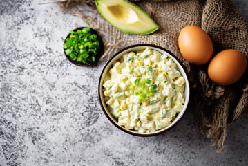 Obraz na płótnie Canvas Avocado egg salad in a bowl