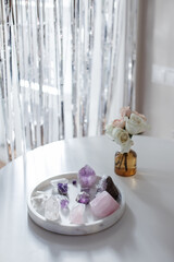 Floral bouquets with amethyst and quartz. A still life composition on marble