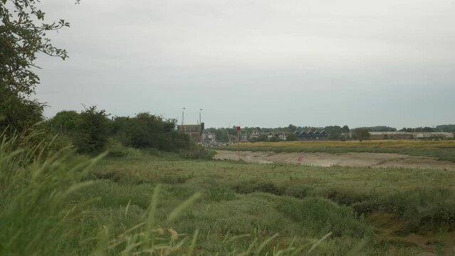 Faversham Creek River Stream with Harbour Dockyard Through Grass Summer