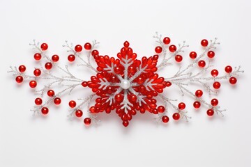 A close up of a snowflake with red beads. Digital image.