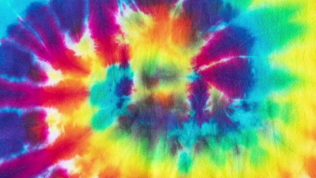 Animated swirl tie dye colourful background waving. Liquid holographic background. Smooth silk cloth surface with ripples and folds in tissue. 4K seamless looping animation.
