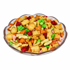 Mixed Chips with Almonds and other fried nuts isolated in glass bowl