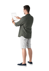 Man using tablet with blank screen on white background