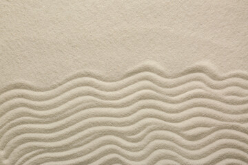 Fototapeta na wymiar White sand with pattern as background, top view. Zen concept