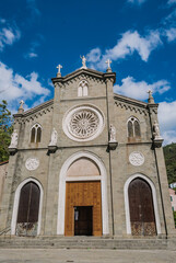 Fototapeta na wymiar Facade of San Giovanni Battista church with gothic rose window in Riomaggiore, ITALY