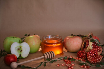 Apples, pomegranate and honey, the traditional food of the Jewish New Year - Rosh Hashana. Copy space background