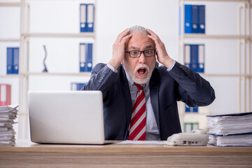 Old male employee and too much work in the office