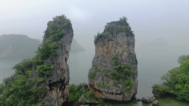 Aerial view amazing Panak island has a cave entrance into the canyon. .Visitors can take a canoe boat to see the big mangrove up in the valley..Panak island is the one landmark of Phang Nga Thailand