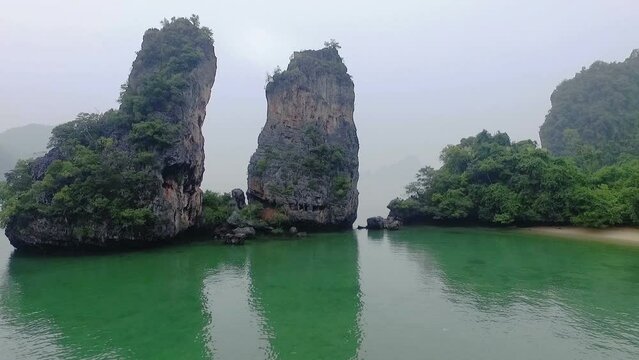 Aerial view amazing Panak island has a cave entrance into the canyon. .Visitors can take a canoe boat to see the big mangrove up in the valley..Panak island is the one landmark of Phang Nga Thailand