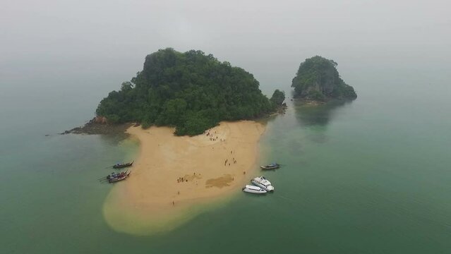Aerial view amazing Panak island has a cave entrance into the canyon. .Visitors can take a canoe boat to see the big mangrove up in the valley..Panak island is the one landmark of Phang Nga Thailand