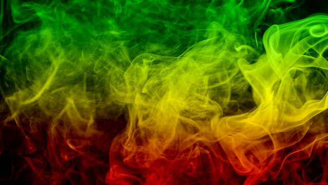 abstract background smoke curves and wave reggae colors green, yellow, red colored in flag of reggae music