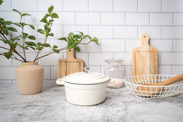 Kitchen counter top with utensil and duct oven pot or cast iron pot. cooking food concept.