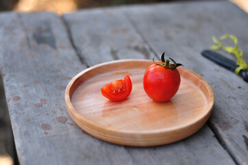 Beautiful organic tomatoes on blurry background, selective focus