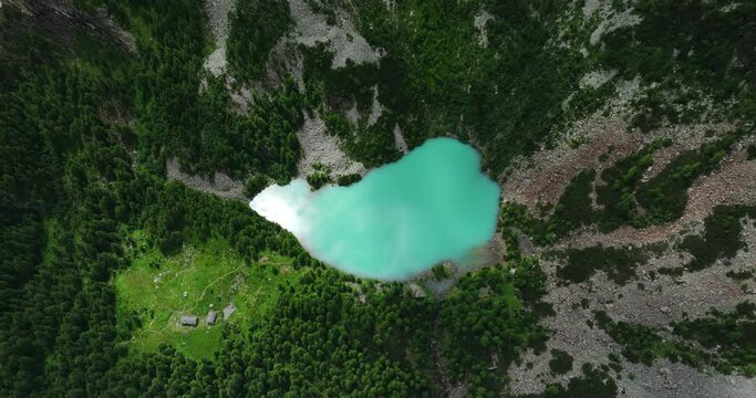 Amazing Alpine Lake Lagazzuolo in Valmalenco valley of Valtellina in summer season, Northern Italy. Aerial drone view