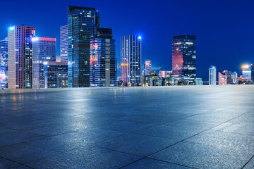 City square and modern commercial office buildings in Shenzhen at night, Guangdong Province, China.
