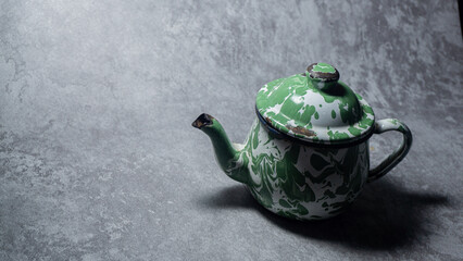 Iron teapot set on gray background