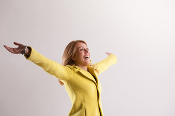 Blonde woman expresses joy, gratitude skyward glance