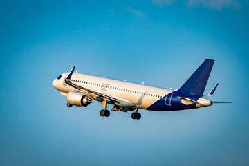 Passengers Commercial airplane flying above dramatic clouds. Concept of fast travel, holidays and business. Commercial transportation concept