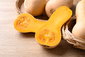 Butternut squash pumpkin in basket on wooden table, Organic vegetable in autumn season