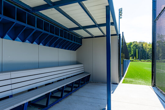 typical nondescript high school baseball third base dugout. No people visible. Not a ticketed event.