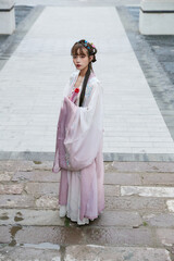 Fototapeta na wymiar An Oriental beauty in ancient attire holding an umbrella