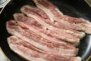 Raw pork belly in iron pan