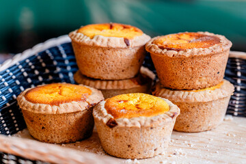 muffins in a basket on a wooden table - mexican bread side view