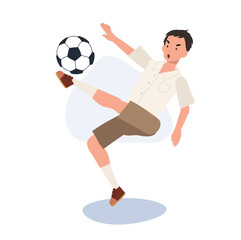 Young Thai Student Boy Kicking Ball After Classes. Young Thai Student Boy Playing Football After School