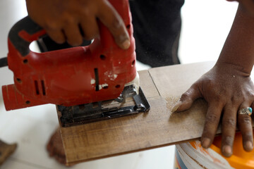 worker joining vinyl floor covering at home renovation