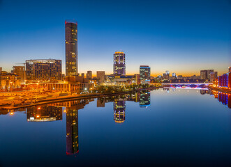 Yekaterinburg city and pond aerial panoramic view at summer or early autumn night. Night city in the early autumn or summer.