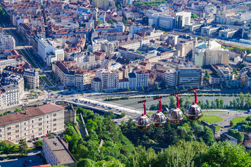 Grenoble-Bastille cable car (Telepherique) approaching Fort de la Bastille station, Grenoble, Auvergne-Rhone-Alpes, France. Gondola to the top of Saint Eybard mountain. Aerial view of the old town