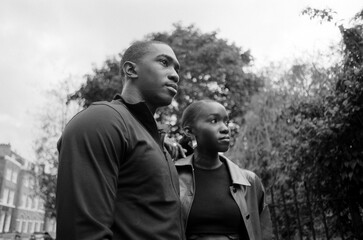 Analog film portrait of twin brothers outdoors.