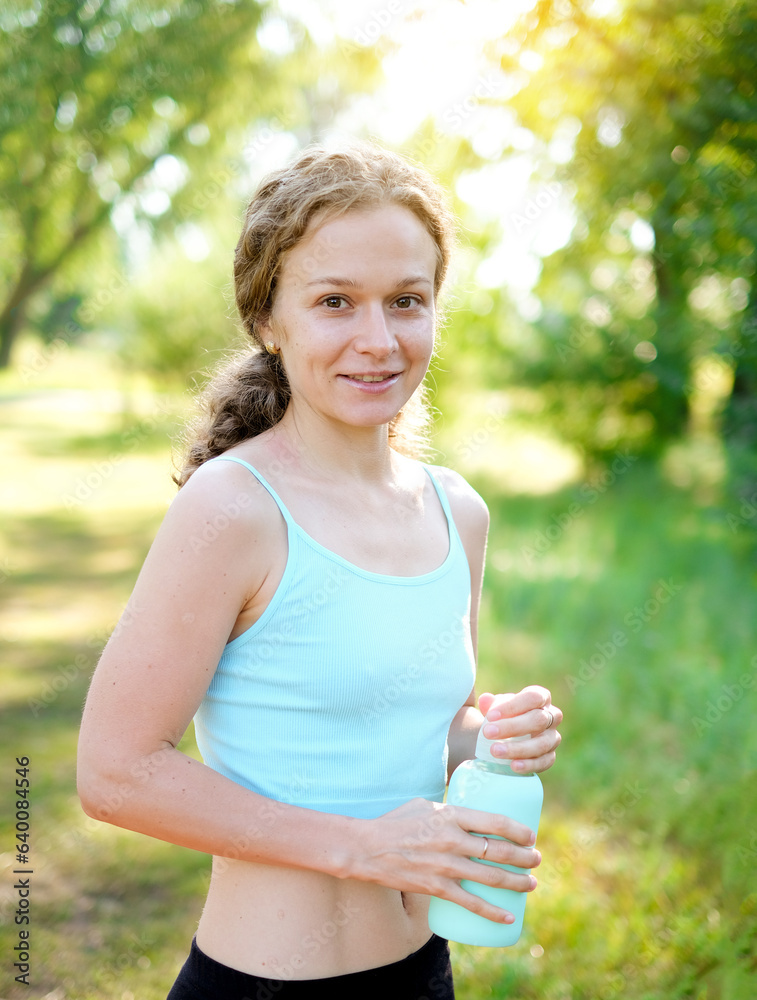 Wall mural drinking water, fitness and exercise woman after sports run and training in nature. workout, hiking 