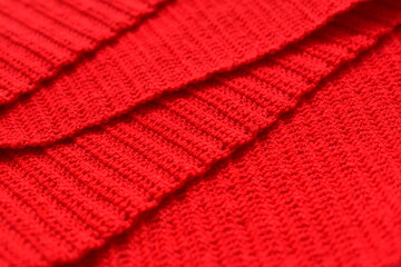 overlap of red wool knitted yarn texture, woolen fabric background