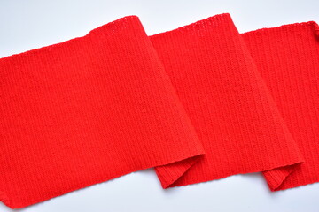 wavy of red wool knitted yarn texture, woolen fabric on white background