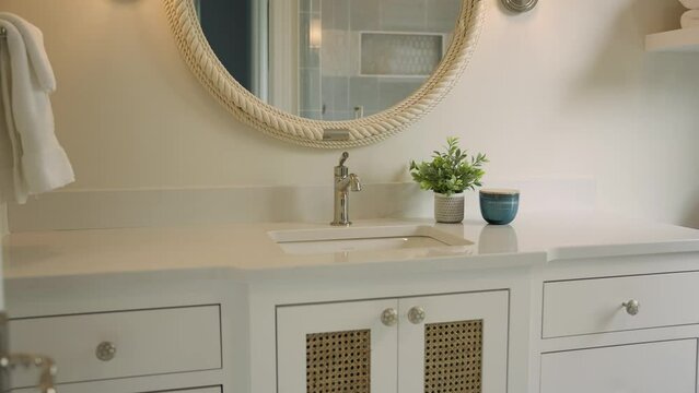 Push in shot of bright white bathroom sink