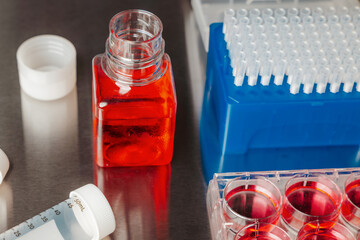 Cell culture media in laboratory for pipet.