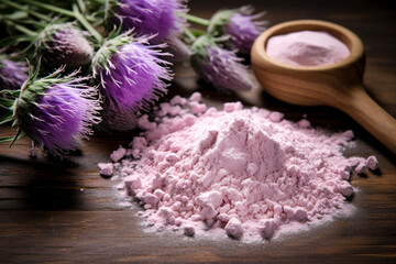 Milk Thistle powder with anti-inflammatory propertie on wooden background. Close-up. 